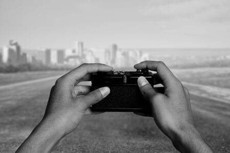 Man with camera in handsの写真素材