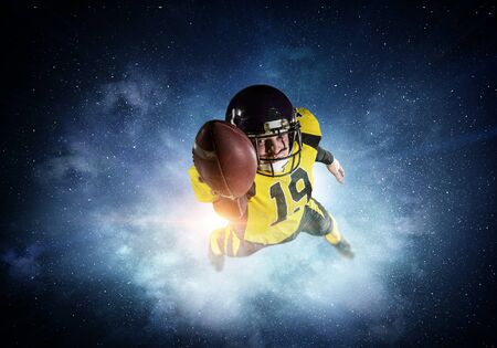 American football player in yellow sport wear. Mixed mediaの写真素材