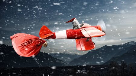 Santa hurrying up to deliver gifts. Mixed mediaの写真素材