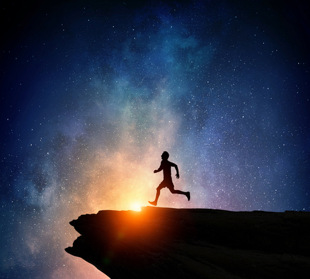 Jogger running at night . Mixed media . Mixed mediaの写真素材