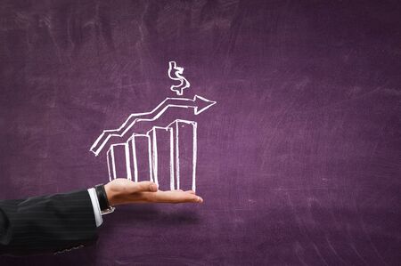 Close of businessman hand holding drawn graphの写真素材