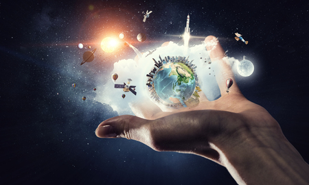 Earth planet in palm . Mixed mediaの写真素材