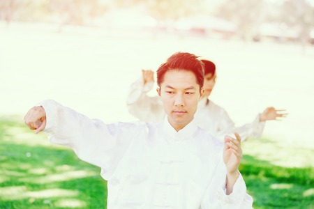 Handsome man practicing thai chiの写真素材