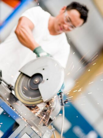Asian worker in production plant on the factory floorの写真素材