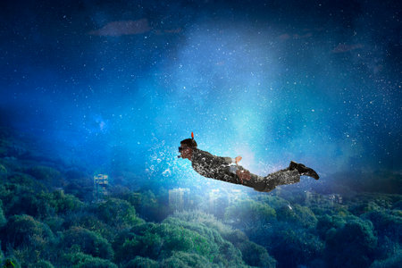 Diving in water businessman . Mixed media . Mixed mediaの写真素材