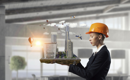 Woman presenting construction modelの写真素材