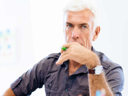 Handsome businessman in officeの写真素材