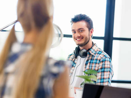Young man working in officeの写真素材