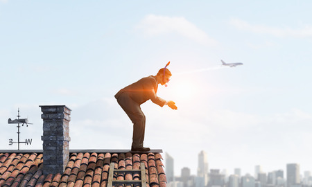 Businessman diving from top . Mixed media . Mixed mediaの写真素材