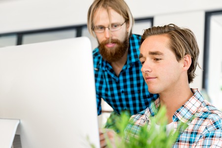 Two office workers at the desk
