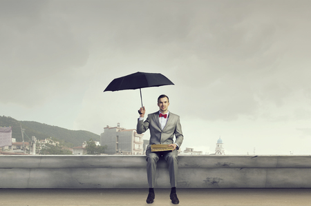 Businessman reading old bookの写真素材