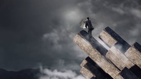 Elegant banker with umbrella. Mixed mediaの写真素材