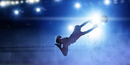 Goalkeeper player in action . Mixed mediaの写真素材