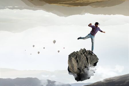 Man in virtual helmet . Mixed mediaの写真素材