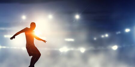 Soccer player in action . Mixed mediaの写真素材