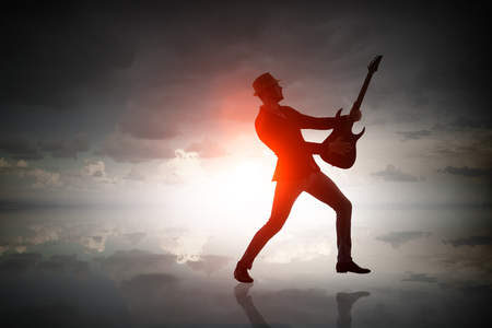 Rock guy with guitar. Mixed mediaの写真素材