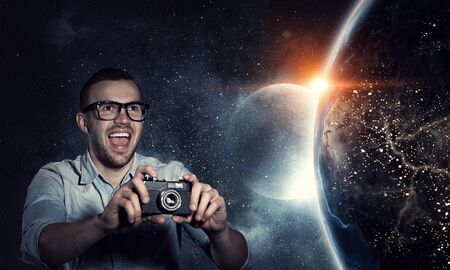 Guy with retro photocamera. Mixed media