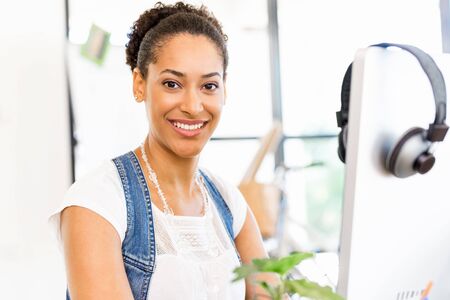 Young woman working in officeの写真素材