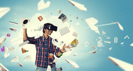 Man in virtual helmet . Mixed mediaの写真素材