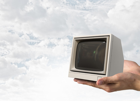 Old tv in hand. Mixed mediaの写真素材