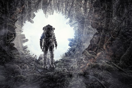 Astronaut in forest . Mixed mediaの写真素材