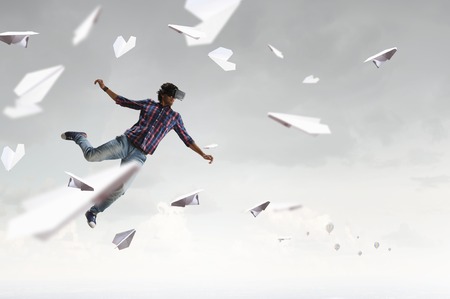 Man in virtual helmet . Mixed mediaの写真素材