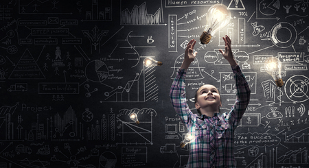 Girl catch light bulb. Mixed mediaの写真素材