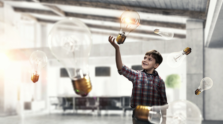 Boy catch light bulb. Mixed mediaの写真素材