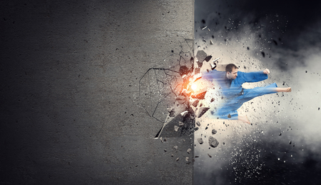 Man in kimono break wall. Mixed mediaの写真素材