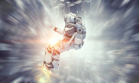 Spaceman on flying board. Mixed mediaの写真素材