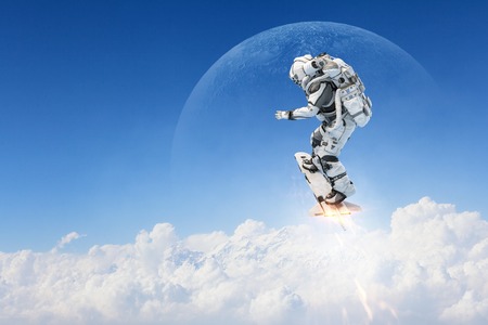Spaceman on flying board. Mixed mediaの写真素材