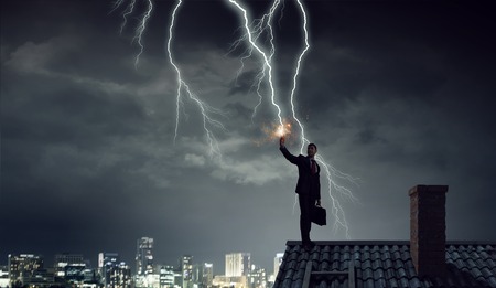 Lightning striking smartphone. Mixed mediaの写真素材