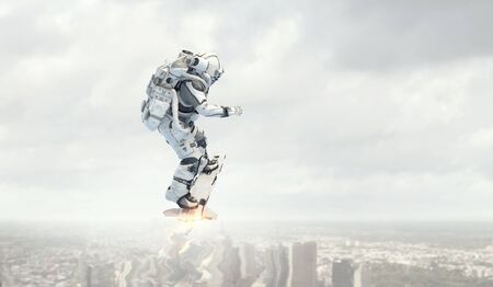Spaceman on flying board. Mixed mediaの写真素材