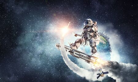 Spaceman on flying board. Mixed mediaの写真素材