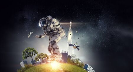 Spaceman on flying board. Mixed mediaの写真素材