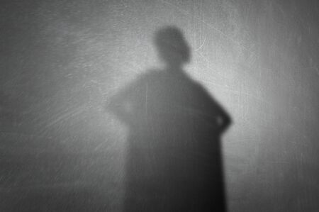Woman shadow on wall. Mixed mediaの写真素材