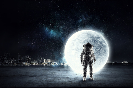 Astronaut explorer in sky. Mixed mediaの写真素材