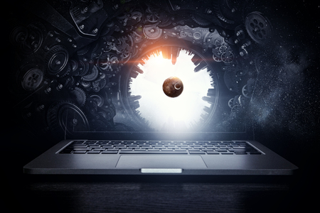 Laptop and construction concept. Mixed mediaの写真素材