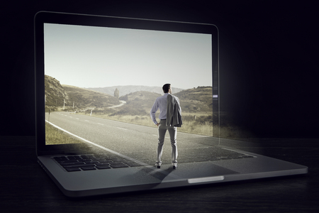 Clouds on laptop screen. Mixed mediaの写真素材