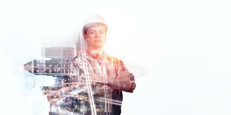 Builder man against cityscapeの写真素材