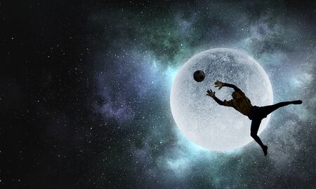 Soccer player with ball outdoorsの写真素材