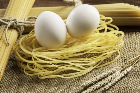 Dry pasta on tableの写真素材