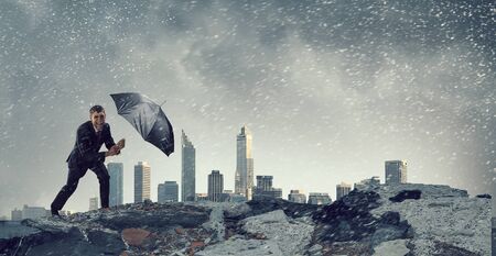 Businessman with black umbrella. Mixed media