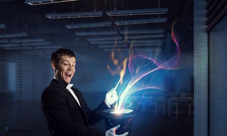 Businessman demonstrating magic . Mixed mediaの写真素材