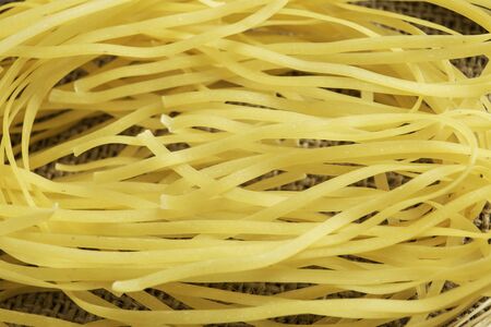 Uncooked spaghetti on table