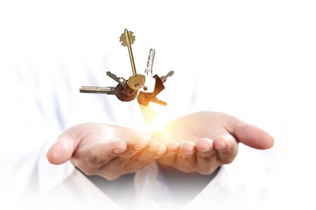 Bunch of keys shown in human palm. Mixed mediaの写真素材