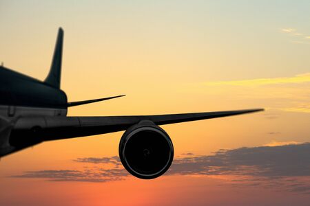 Turbine and wing of airplane flying in sky. Mixed mediaの写真素材