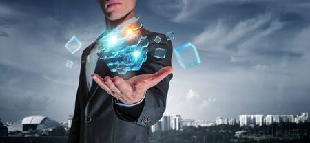 Cube figure in palm. Mixed mediaの写真素材