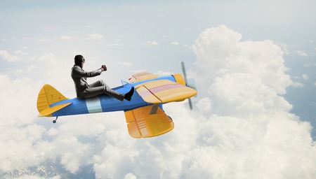 Aviator in drawn airplane. Mixed mediaの写真素材