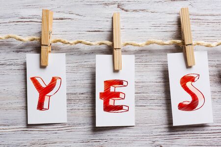 Paper pinned to rope. Mixed mediaの写真素材